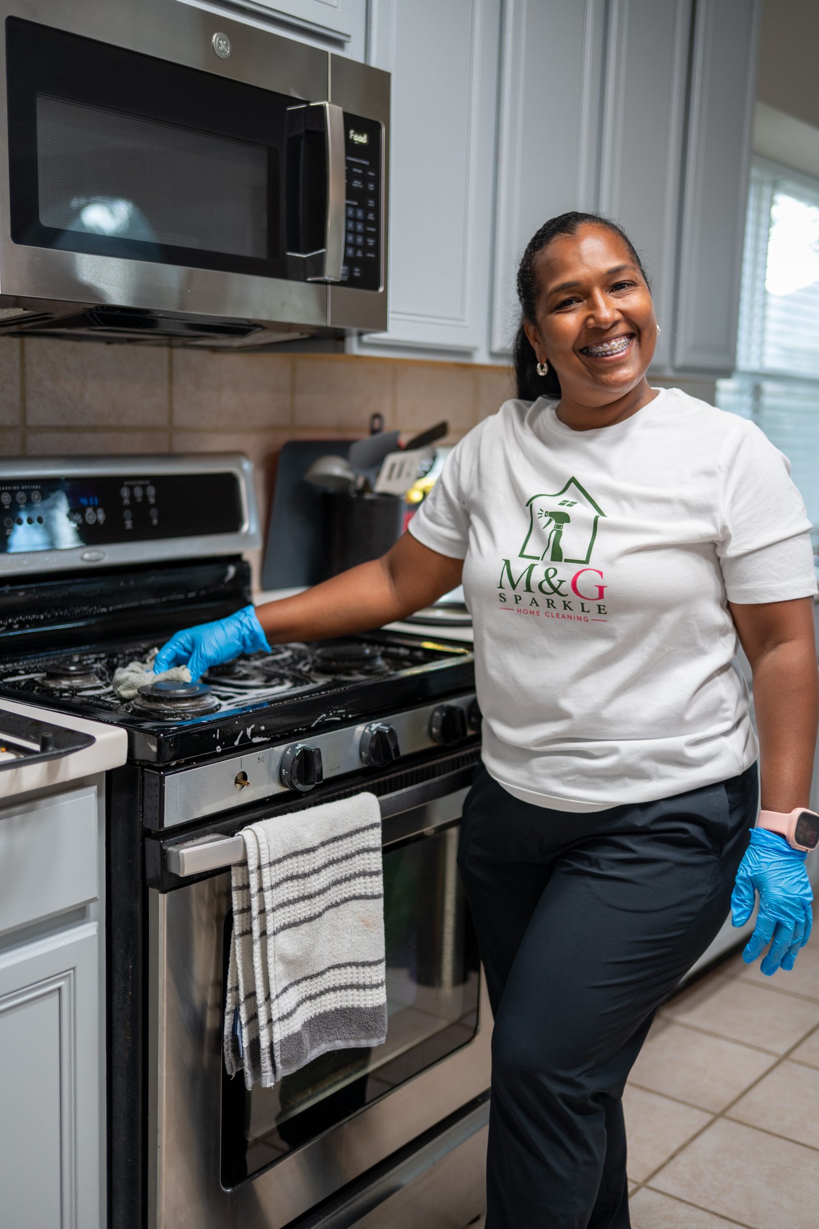 Cleaning a kitchen range in an M&G Sparkle shirt
