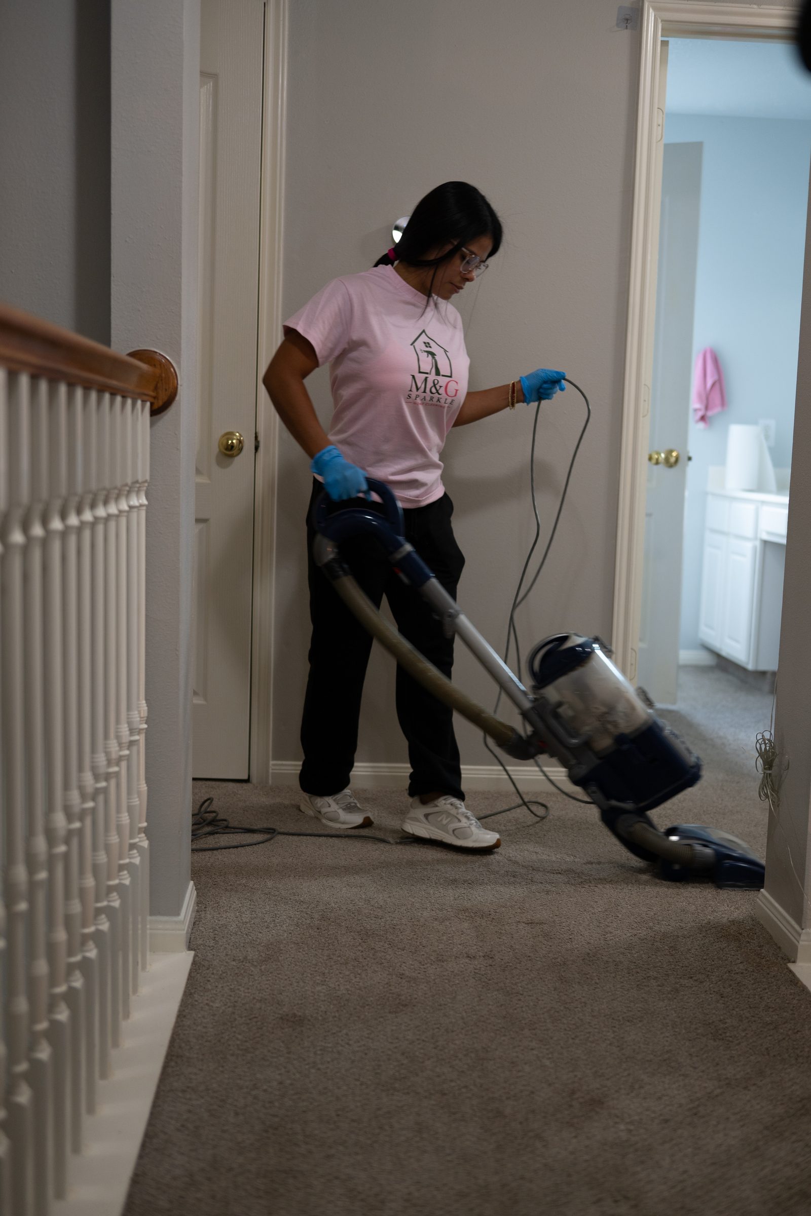 Vacuuming an upstairs hall
